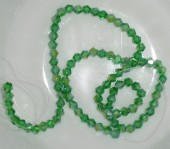 Margele sticla bicon fatetate 4mm verde mediu tr. cu irizatii - cca 95buc